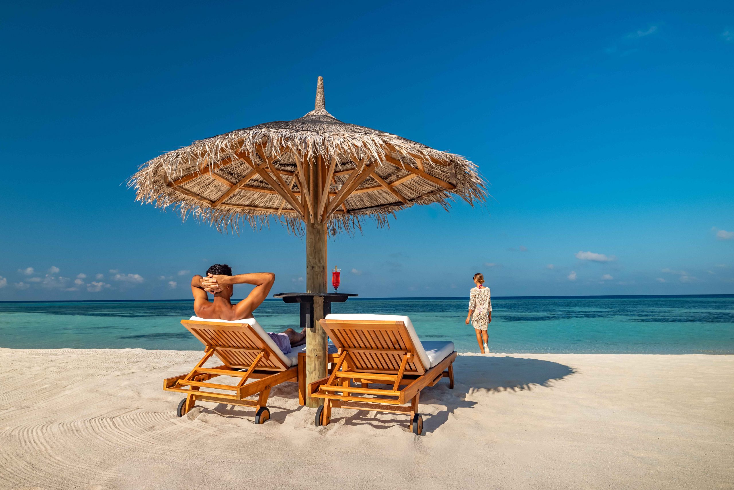 This image has an empty alt attribute; its file name is OZEN-LIFE-MAADHOO-Lifestyle-Couple-Lounging-on-Beach-3-exp-01.2029_2_11zon-scaled.jpg